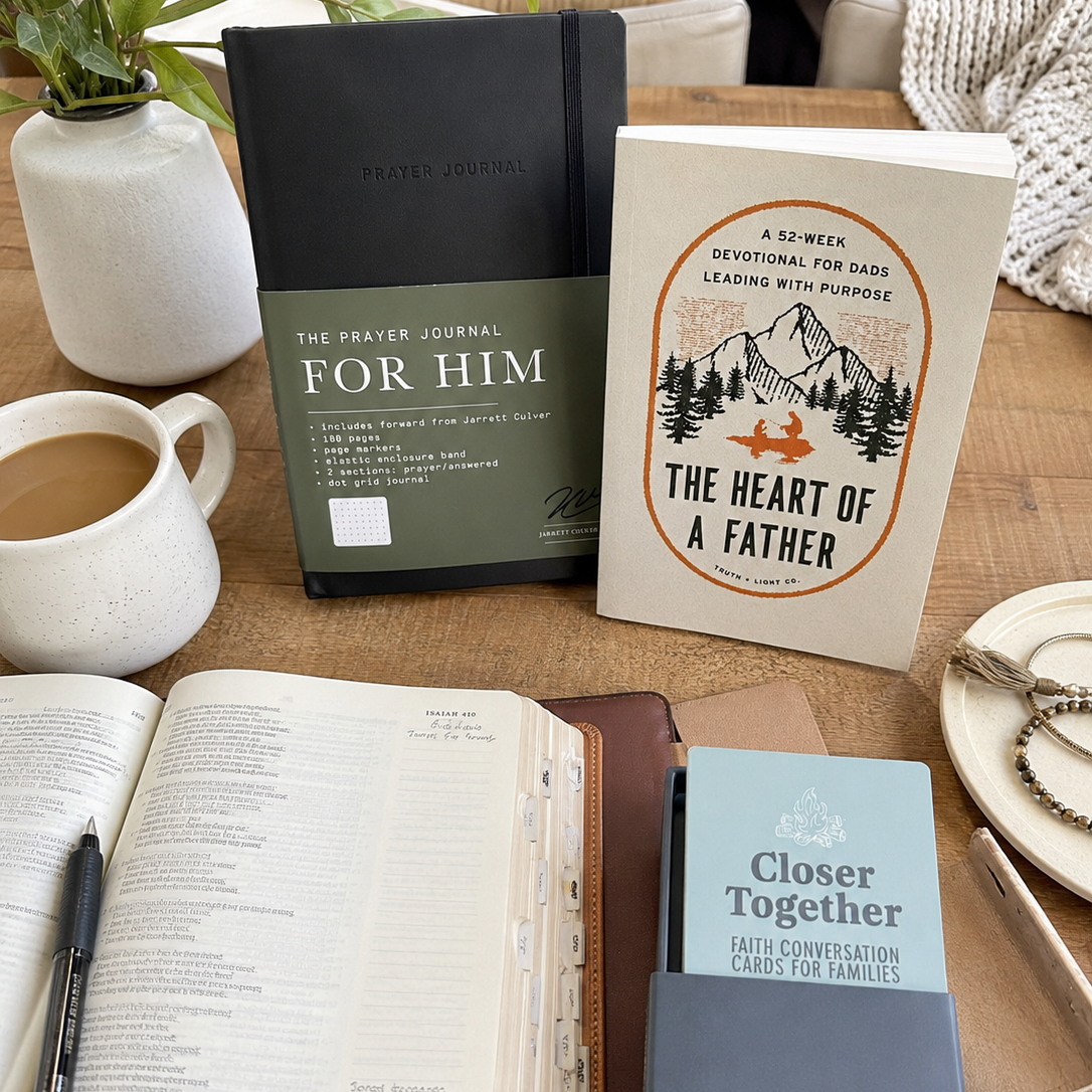 Tabletop scene with books, a prayer journal, and a cup of coffee.
